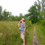 birdwatching Plenty of birds appear along the trail while hiking at West Beach. Lou is looking for a bird that he claimed was calling his name.