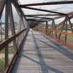 Savanna footbridge Before reaching Savanna, the Great River Trail takes you over a 1,100-foot-long pedestrian bridge arching over Plum Creek and local railroad lines.