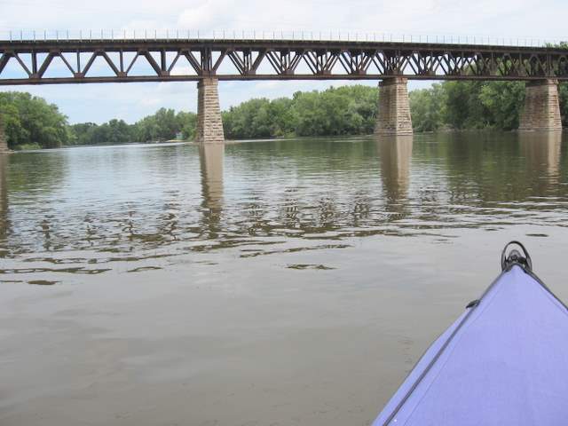 Heading under a railroad bridge south of Elgin